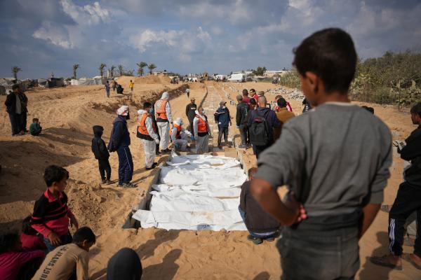 Bodies of unidentified Palestinians are buried in the Gaza Strip, November 14, 2025.