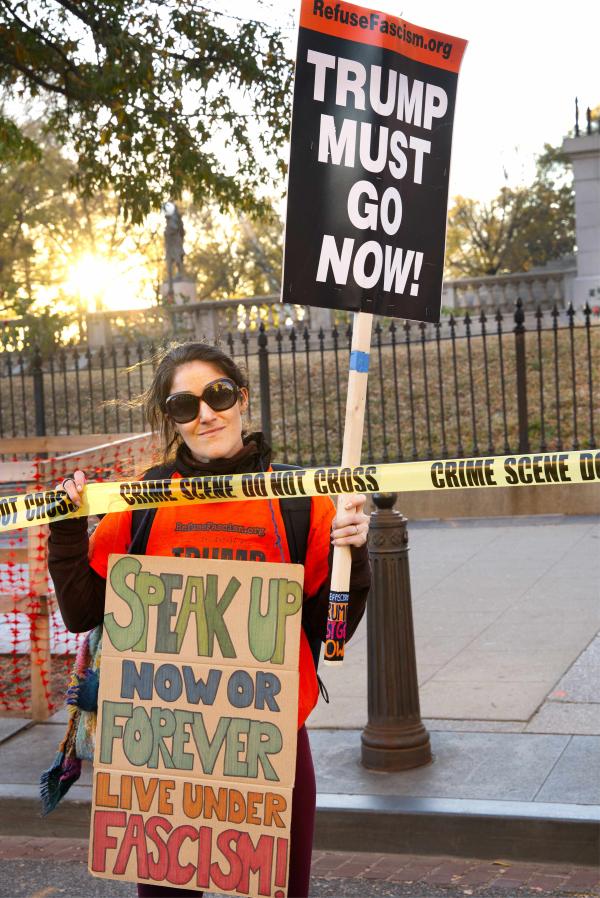 Protester at Surround the White House with sign "Speak up now or forever live under fascism!"