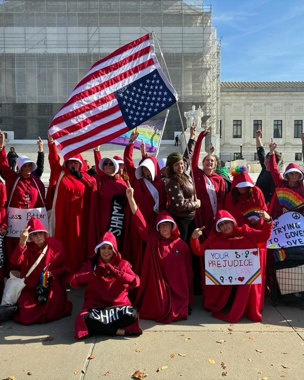 Handmaids in front of SCOTUS with upside-down flag, November 7, 2025.