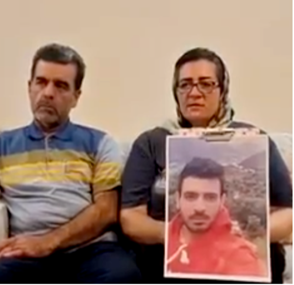 Parents with picture of their son, Ehsan Faridi, who is on death row.