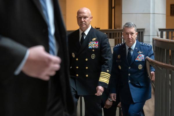 Admiral Frank Bradley and General Dan Caine walk to meeting with senators, December 4, 2025.