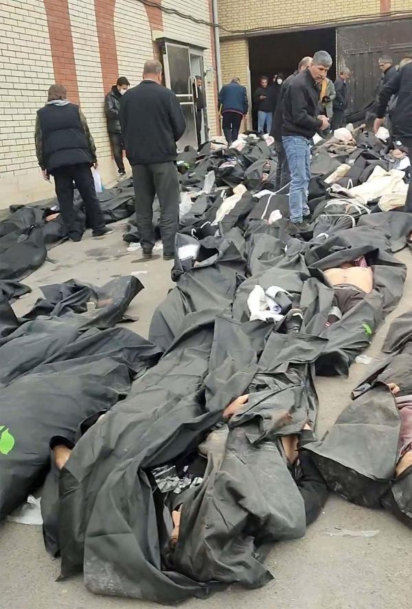 Bodies lie in body bags on the ground outside Kahrizak Forensic Medical Centre in Tehran, Iran, January 11, 2026.