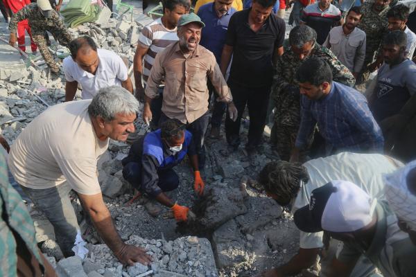 Searching through the rubble Israeli-U.S. strike on a girls' elementary school in Minab, Iran, February 28, 2026.