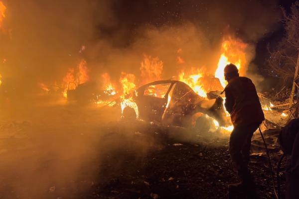 Hosing a blazing car from The site of one of the Israeli airstrikes, in Beirut, Lebanon, April 1, 2026.