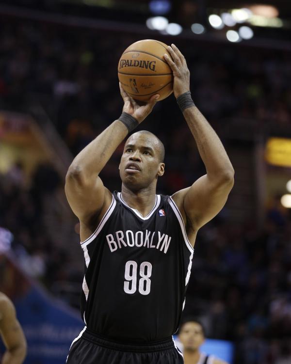 Brooklyn Nets' Jason Collins shoots against the Cleveland Cavaliers, April 16, 2014.
