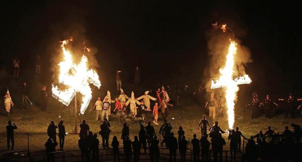 The Klan continues to burn crosses and swastikas for intimidation, such as in this April 2016 incident.