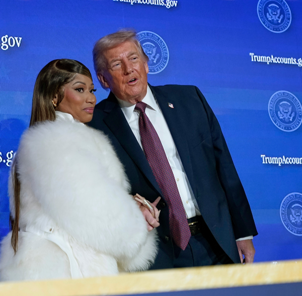 Nicki Minaj and Donald Trump hold hands at launch of Trump Accounts, January 2026.