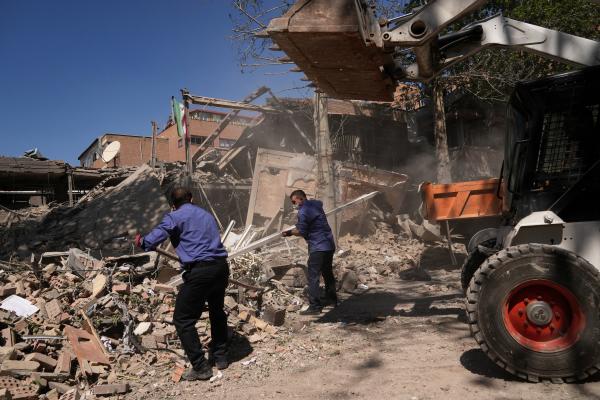Men dig through debris from U.S.-Israeli airstrike at Tehran's Sharif University of Technology, Iran, April 6, 2026.