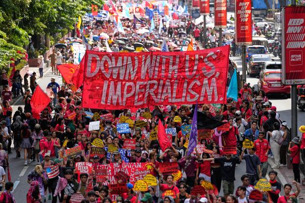 May Day rally marches towards the Malacanang Presidential palace in Manila, Philippines, May 1, 2026 carrying banner "Down with US Imperialism."