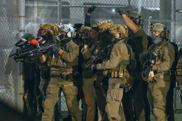 At New Jersey Delaney Hall detention center, ICE agents aim less-lethal launchers at protesters, May 29, 2026.