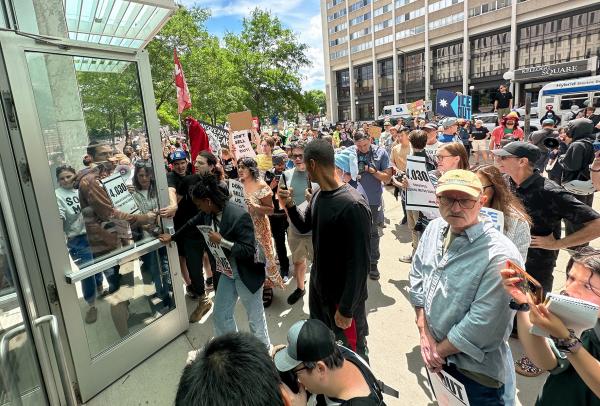 Protesters stand outside federal court in St. Louis, Minnesota, June 16, 2026.