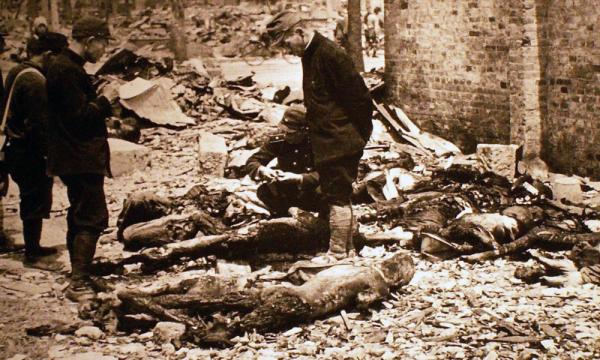 After U.S. firebombed Tokyo, March 9, 1945, residents search charred ruins.