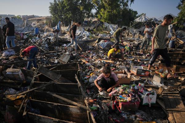Palestinians search for food in the wreckage of their tents following an Israeli airstrike in Khan Younis, June 30, 2026.