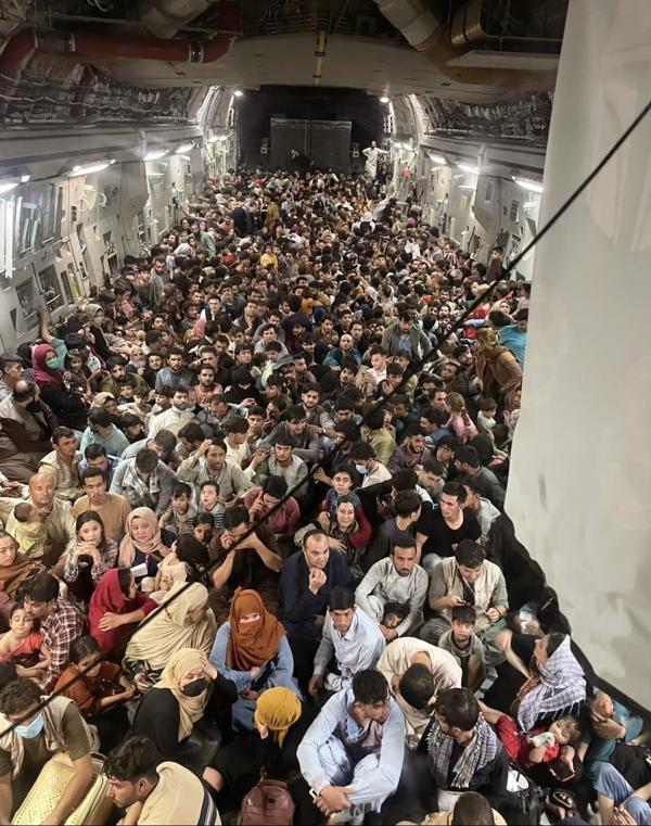 Image from Kabal airport of Afghan citizens packing into a U.S. Air Force plane, August 15, 2021.