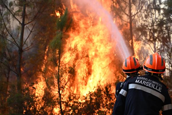 Firefighters work to extinguish a fire in southwestern France, July 29, 2026.