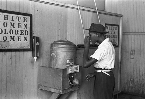 Colored_drinking_fountain_from_mid-20th_century_with_african-american_drinking-x600px.jpg