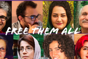 "Free them all" with pictures of Iranian political prisoners