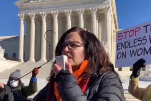 Sunsara Taylor speaking at rise up for abortion rights, January 22, 2022, in front of SCOTUS.