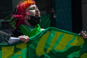 Woman with green banner
