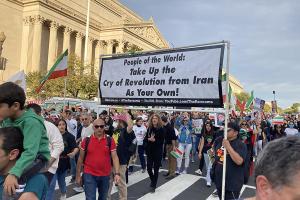 Washington, DC, Supreme Court, October 22, 2022: RevComs carry banner to People of the World Support Iran