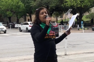 Coco Das speaking at Austin protest, April 8.