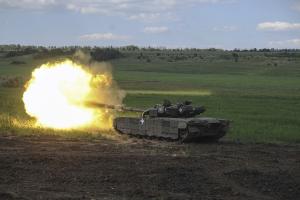 A Ukrainian tank fires in Chasiv Yar, the site of fierce battles with the Russian forces, June 7, 2023.