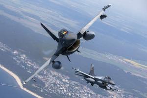 F-16 military fighter jets over Baltic Sea, for Ukraine.