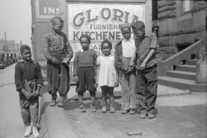 Kids in front of a “kitchenette” apartment, Chicago