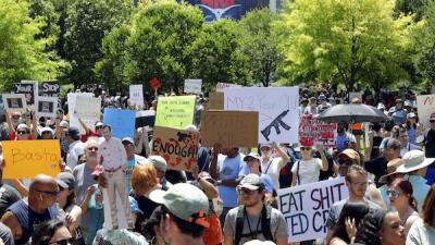 Protesters outside the NRA convention after the killings in Buffalo and Uvalde