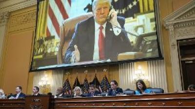 January 6 hearing with projection of Trump