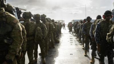 International coalition of armed forces practice drills in Rim of the Pacific.