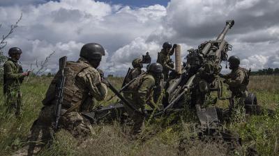 Ukrainian soldiers prepare to fire U.S.-supplied M777 howitzer, July 2022.