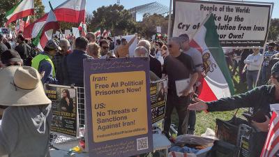 Washington, DC, October 22, 2022: People of the World banner and posters at rally
