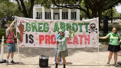 RU4AR in Austin, Texas with banner: "Greg Abbott is Pro Death."