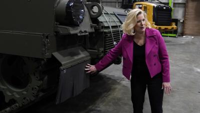 Christine Wormuth pets tank at factory