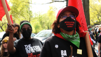 Woman marching with red flag and revolution nothing less hat