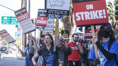 Members of the The Writers Guild of America (WGA) picket outside the Netflix, Inc., building on Sunset Blvd, on Friday, May 5, 2023, in Los Angeles.