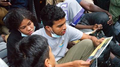 Migrants at Roosevelt Hotel, NYC, read the proclamation, We Are the Revcoms, August 1, 2023.
