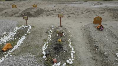 Graves of migrants who died in November 2021, trying to cross the English Channel.