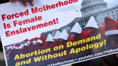 Sign: Forced motherhood is female enslavement, abortion on demand and without apology