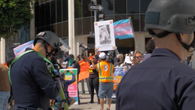 Revcoms defending the rights and lives of people under attack by anti-LGBTQ fascists in and out of government, at the Los Angeles Unified School District meeting.