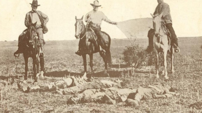 The bodies of three Mexicans who were lynched in Texas being dragged to town by three Texas rangers, 1915.
