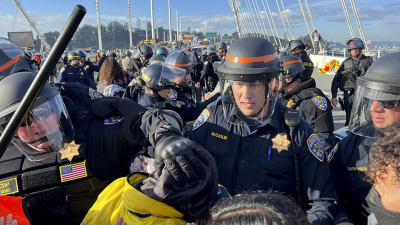 Cops trying to clear demonstrators who shut down the San Francisco-Oakland Bay Bridge protesting Israel’s war on Gaza, in conjunction with the APEC Summit, November 16, 2023.