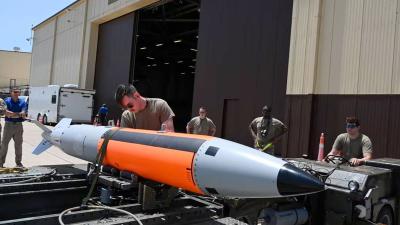 USAF squadron loads an unarmed B61-12 bomb, which can be outfitted with a nuclear warhead, on a B-2 Spirit bomber.