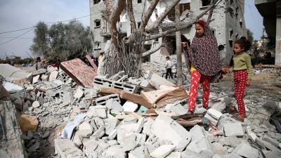 Gaza strip residents search rubble from Israeli bombing, March 29, 2024.