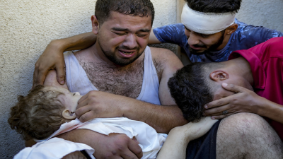 Men with dead child in Gaza