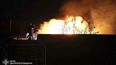 Ukraine rescue workers put out a fire caused by a Russian hypersonic missile strike in Dnipro, November 21, 2024.