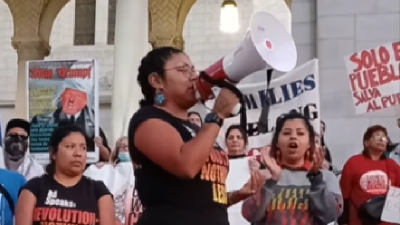 The Revcom Corps joined the National Day Laborer Organizing Network in protest on   in a rally and march for International Migrants Day (Día Internacional del Inmigrante).