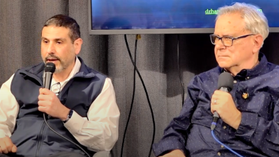 Dr. Adam Hamawy with Alan Goodman at Revolution Books report-back from Gaza.