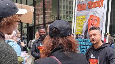 Noche Diaz speaking to individuals at Chicago April 5 protest.